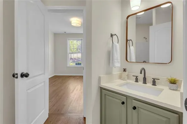 a bathroom with a sink and a mirror