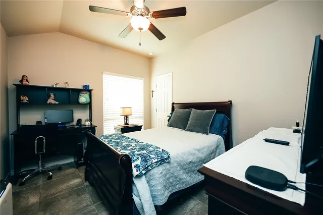 a bedroom with a bed and a table