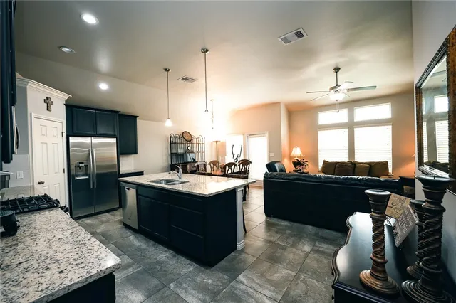 a kitchen with a refrigerator and countertop