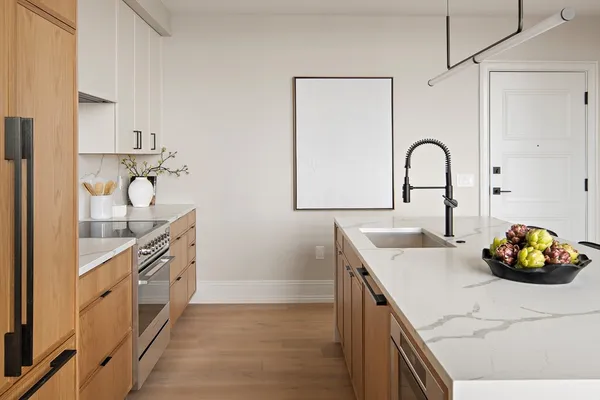 a kitchen with a sink and cabinets
