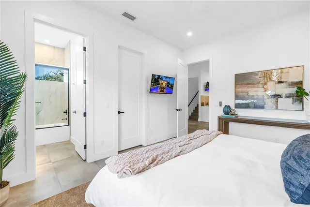a view of swimming pool with outdoor seating and plants