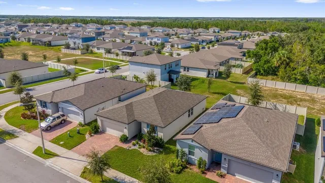 an aerial view of a house with a garden