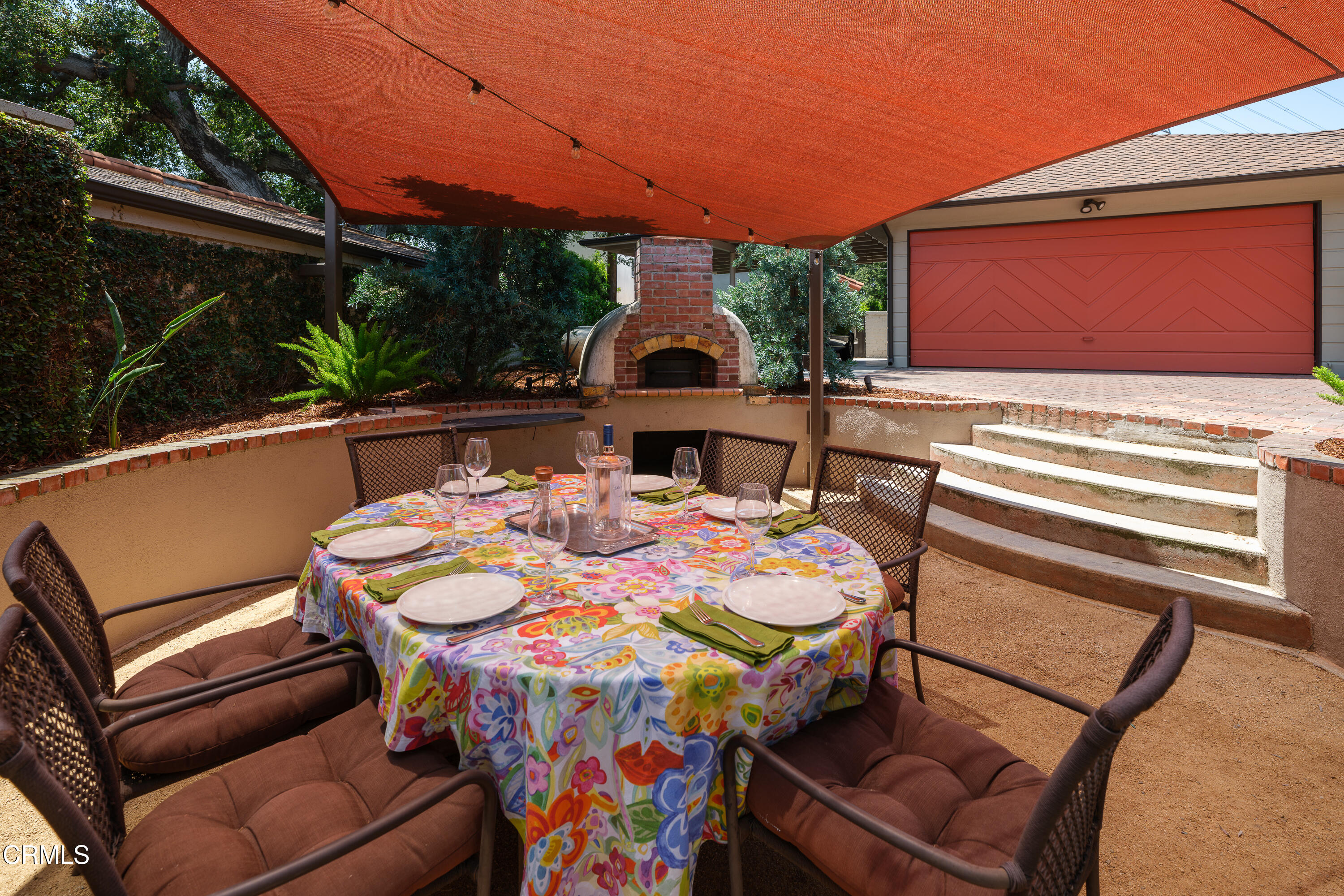 3312 Thorndale Road Pasadena, CA 91107 - Photo 44 of 48 a view of a patio with table and chairs with wooden floor and fence