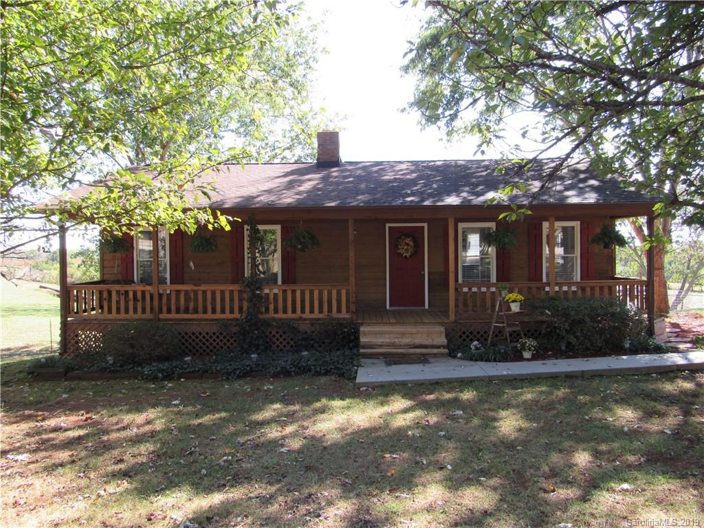 1226 Howards Creek Mill Road Vale, NC 28168 - Photo 1 of 22 a front view of a house with a yard