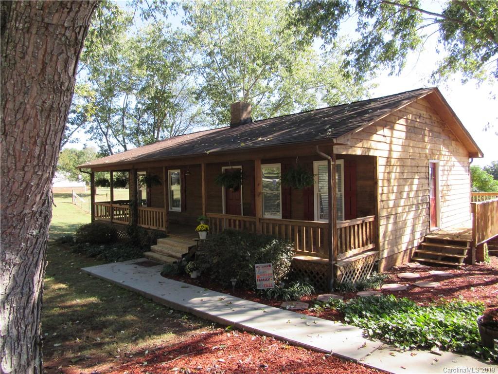 1226 Howards Creek Mill Road Vale, NC 28168 - Photo 2 of 22 a front view of a house with garden