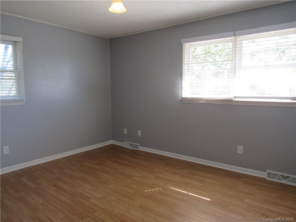 1226 Howards Creek Mill Road Vale, NC 28168 - Photo 16 of 22 an empty room with a window