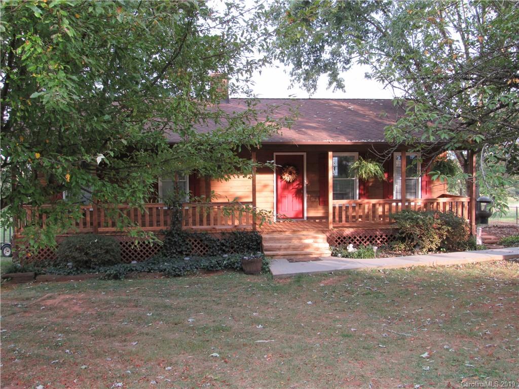 1226 Howards Creek Mill Road Vale, NC 28168 - Photo 3 of 22 a view of a house with a yard and tree