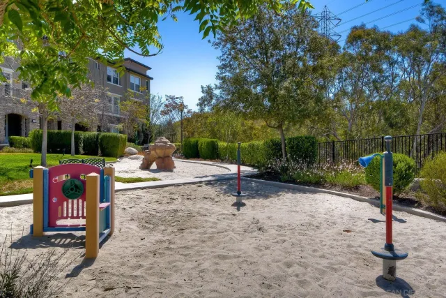 a view of a tables and chairs under an umbrella