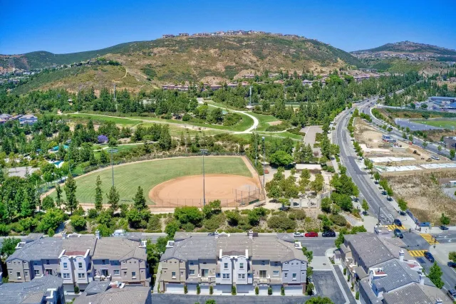 a view of swimming pool is middle in the garden