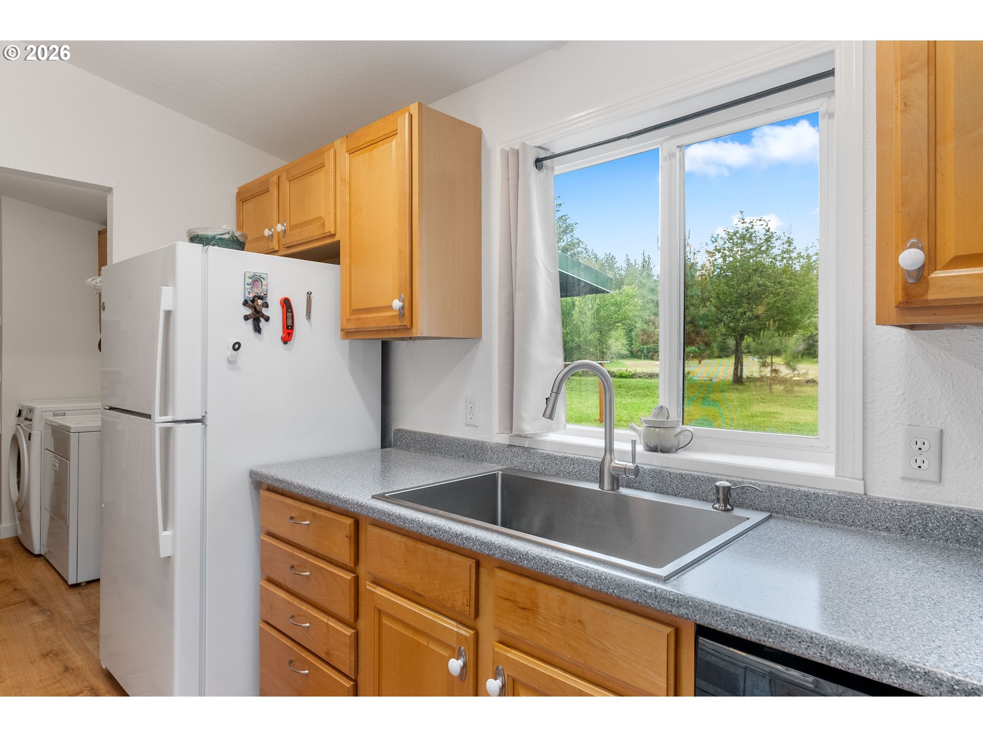 451 Cannavinna Road Carson, WA 98610 - Photo 13 of 33 a kitchen with a sink a refrigerator and a large window