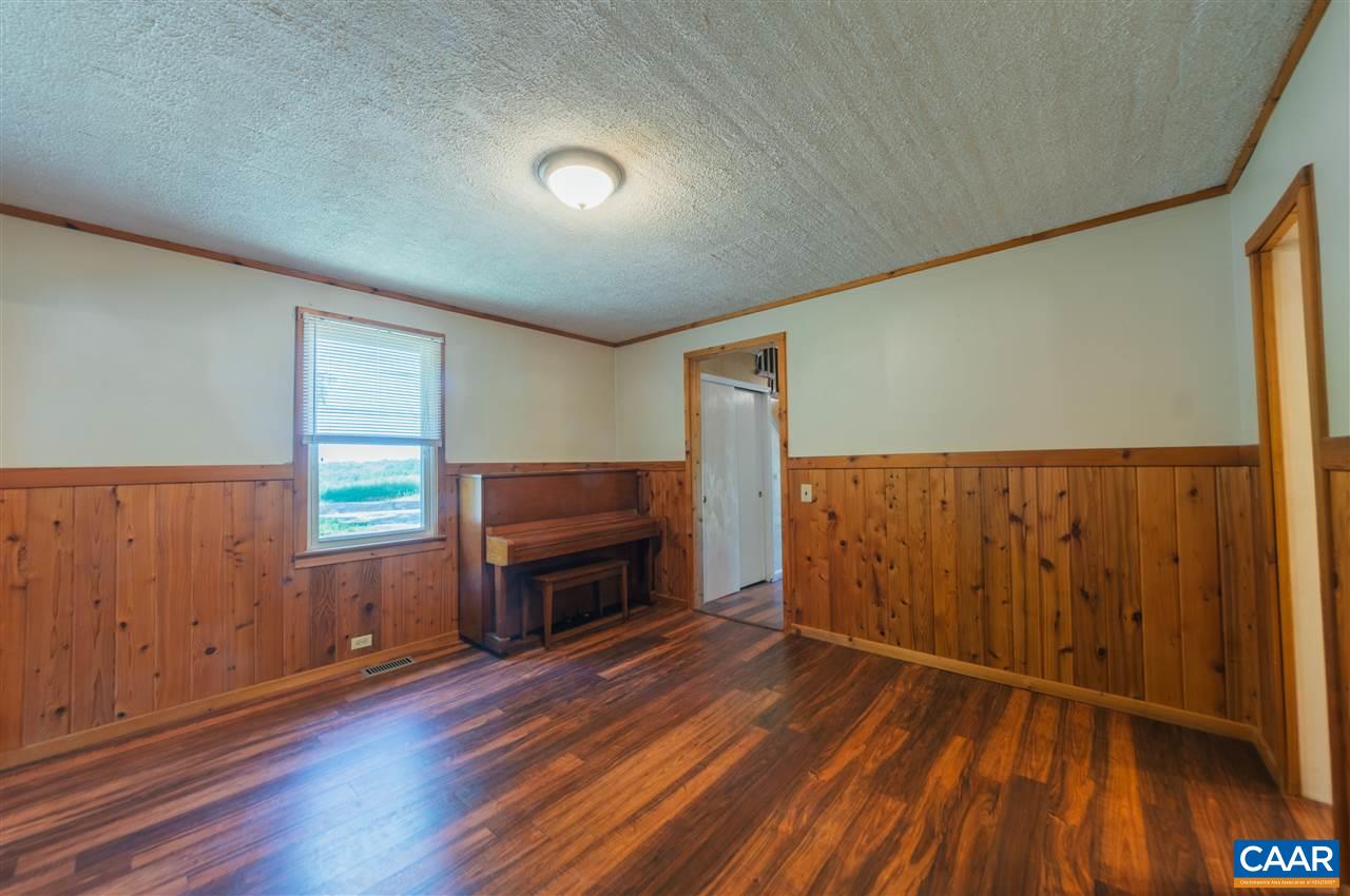 1614 Good Hope Church Road Aroda, VA 22709 - Photo 10 of 32 a view of empty room with wooden floor and fan