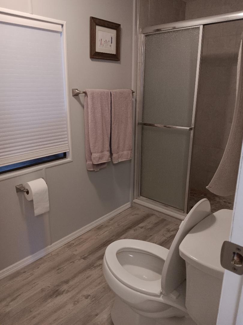 6985 Southeast Amendment Street Hobe Sound, FL 33455 - Photo 11 of 27 a bathroom with a sink and toilet