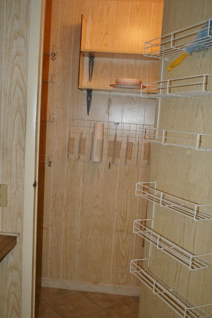 6985 Southeast Amendment Street Hobe Sound, FL 33455 - Photo 6 of 27 a bathroom with a shower