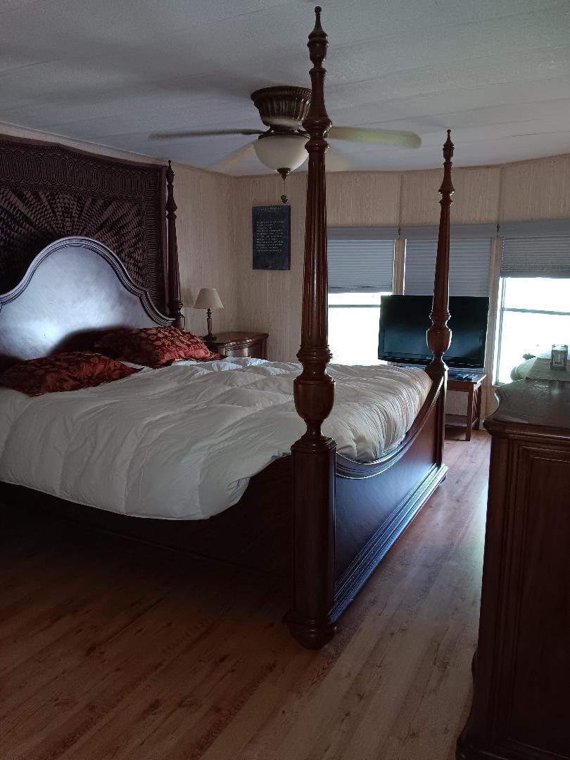 6985 Southeast Amendment Street Hobe Sound, FL 33455 - Photo 10 of 27 a living room with furniture and a wooden floor