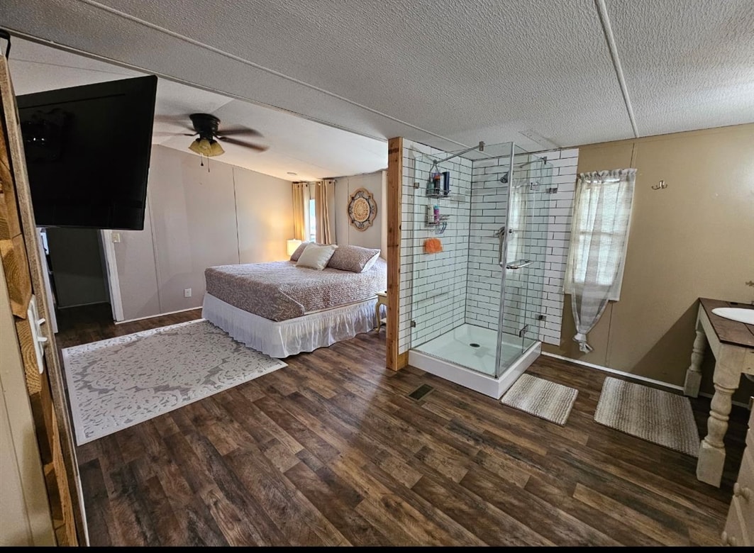 390 Wharf Road Savannah, TN 38372 - Photo 4 of 17 Wood-finish flooring extending throughout the open area