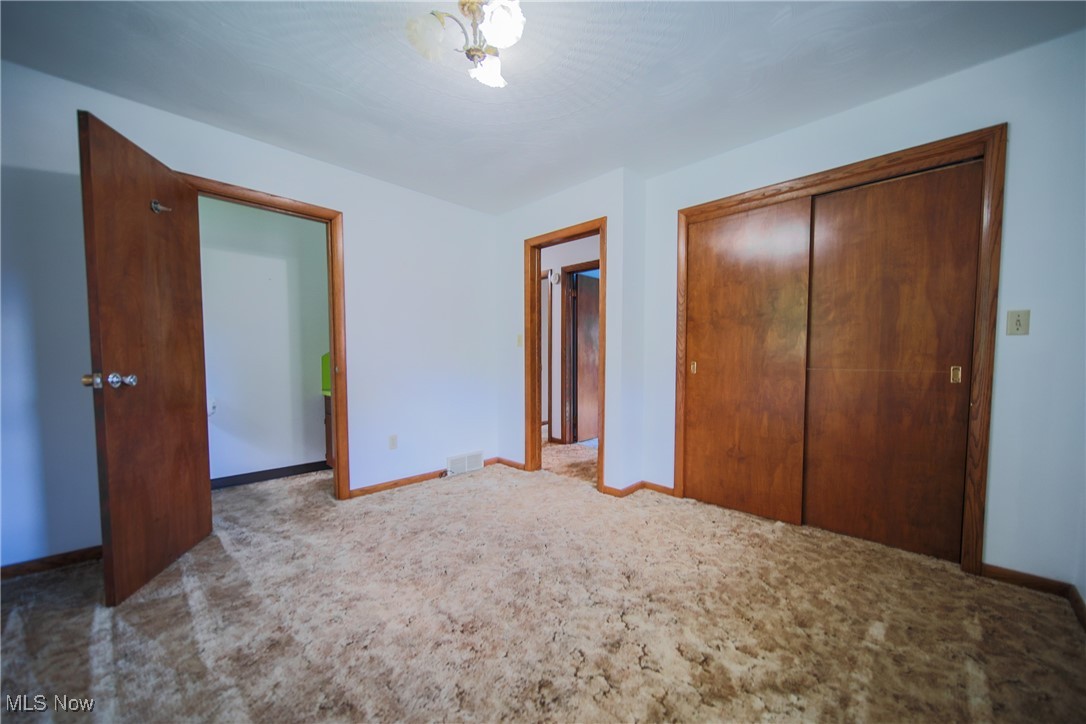 1580 Ruth Drive Wooster, OH 44691 - Photo 24 of 35 Unfurnished bedroom featuring a closet and light carpet