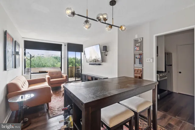 a view of a dining room with furniture window and wooden floor