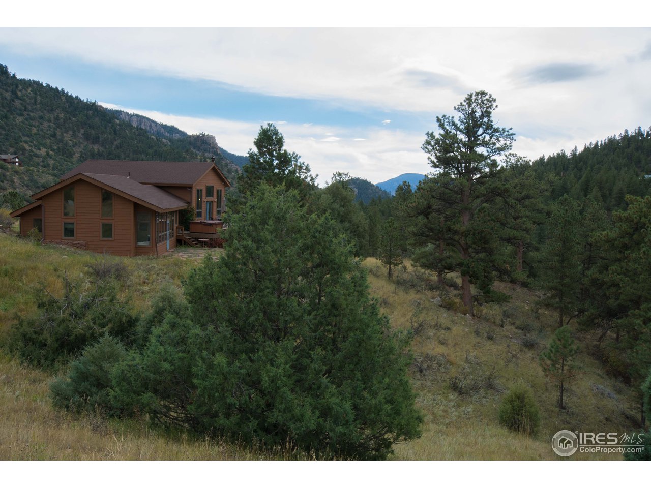 1473 Streamside Drive Drake, CO 80515 - Photo 1 of 24 a view of a house with a yard