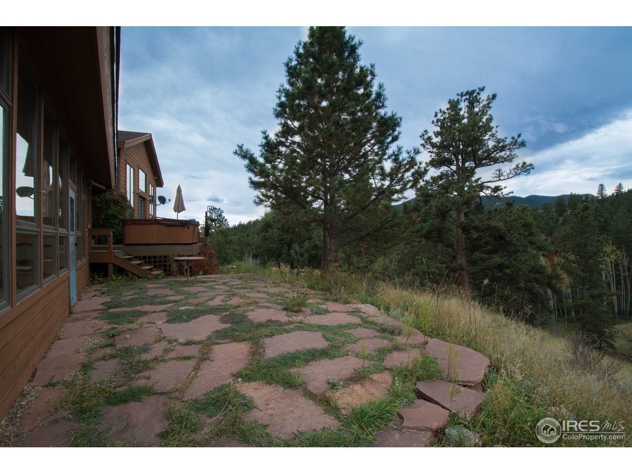 1473 Streamside Drive Drake, CO 80515 - Photo 19 of 24 a view of a backyard with sitting area