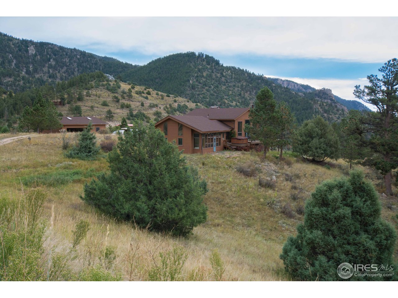 1473 Streamside Drive Drake, CO 80515 - Photo 21 of 24 a view of a lake with a mountain