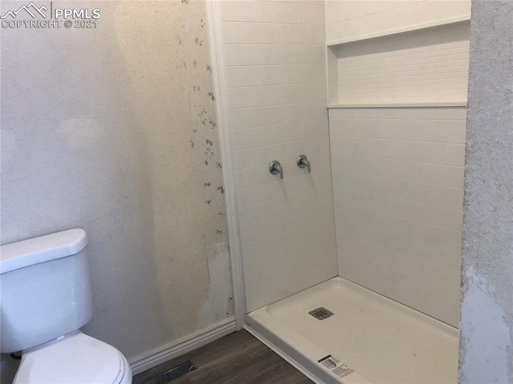 34755 Big Springs Road Yoder, CO 80864 - Photo 15 of 29 a bathroom with a toilet and a shower
