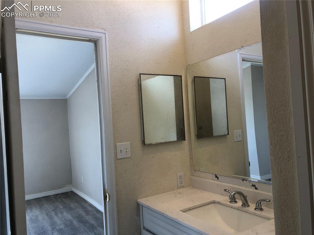 34755 Big Springs Road Yoder, CO 80864 - Photo 17 of 29 a bathroom with a sink and a mirror
