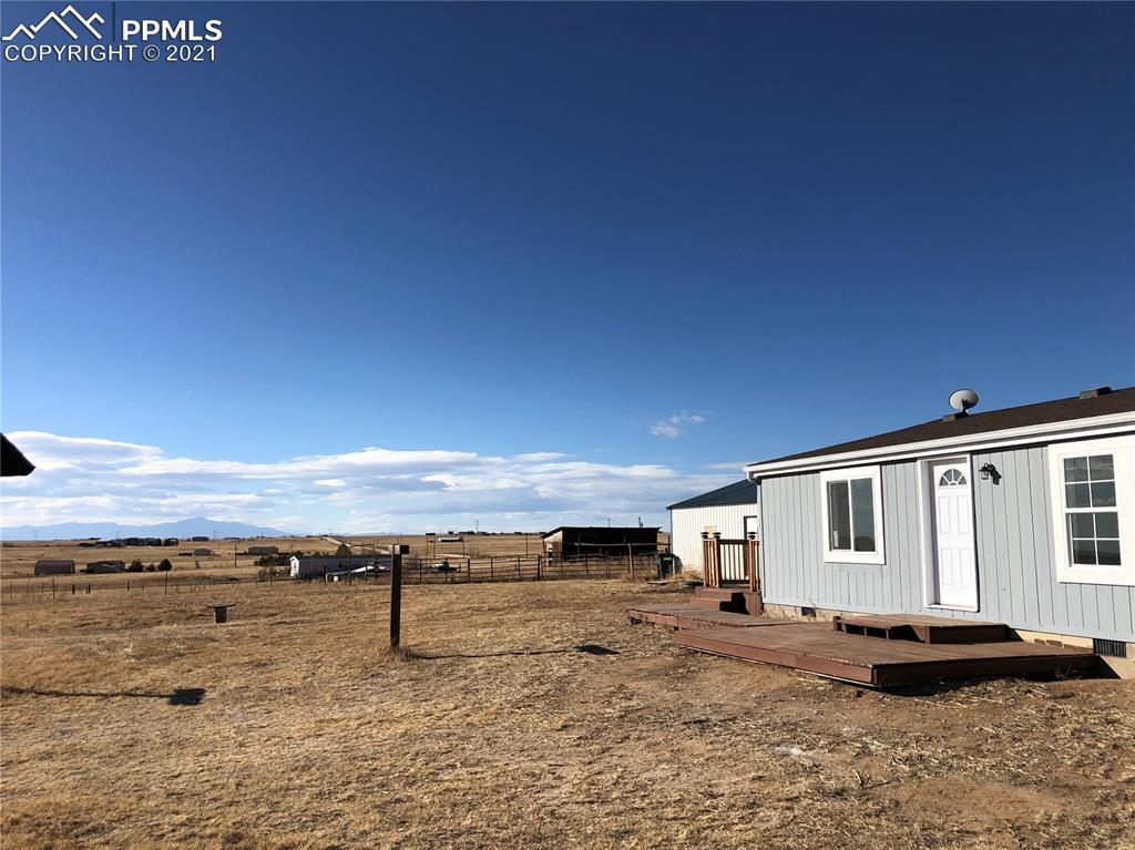34755 Big Springs Road Yoder, CO 80864 - Photo 2 of 29 a view of a terrace with a lake