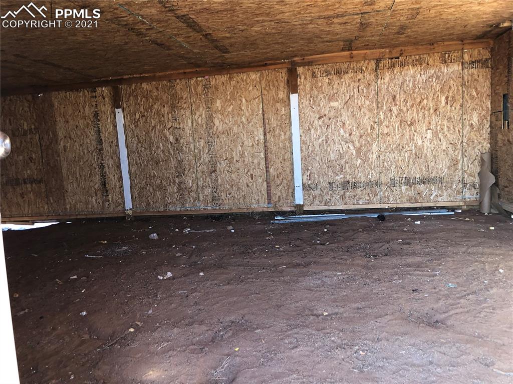 34755 Big Springs Road Yoder, CO 80864 - Photo 26 of 29 a view of a room with wooden floor and a window