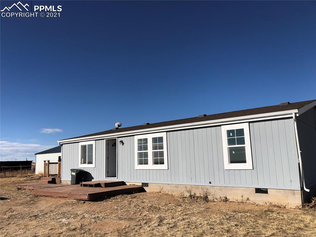34755 Big Springs Road Yoder, CO 80864 - Photo 28 of 29 a front view of a house with a yard