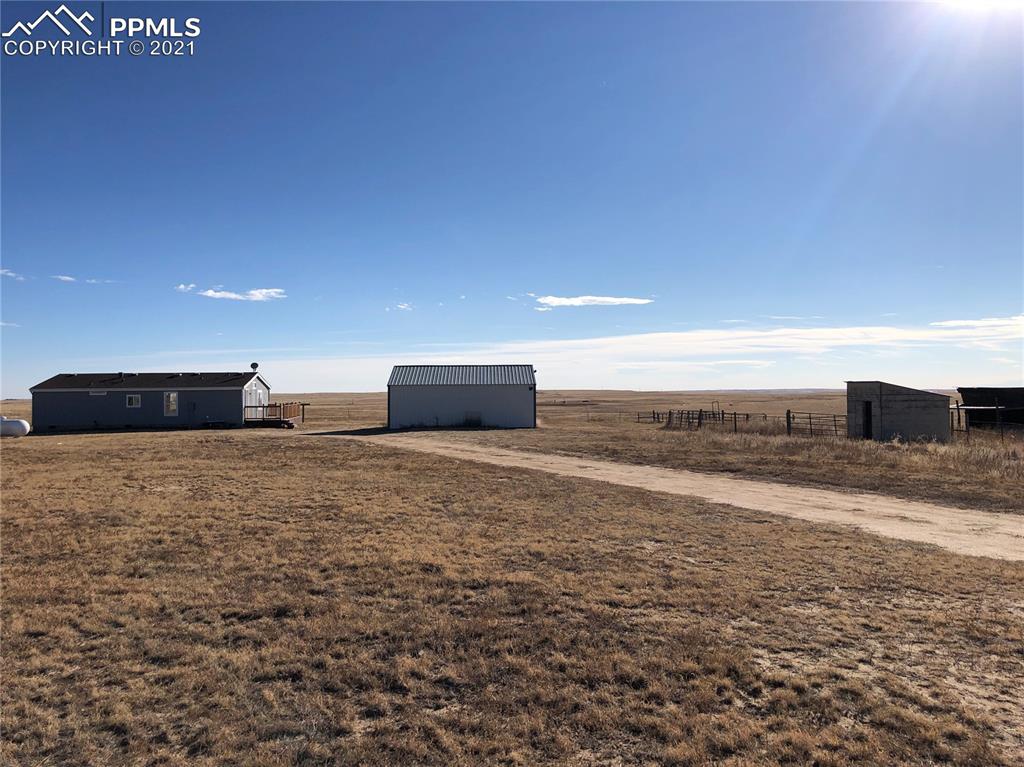 34755 Big Springs Road Yoder, CO 80864 - Photo 3 of 29 a view of empty room with wooden floor