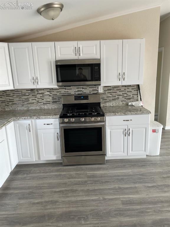34755 Big Springs Road Yoder, CO 80864 - Photo 10 of 29 a kitchen with granite countertop a stove and a sink
