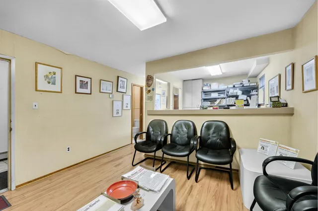 a bedroom with furniture and a wooden floor