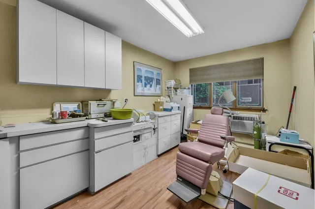 a room with a bed and furniture