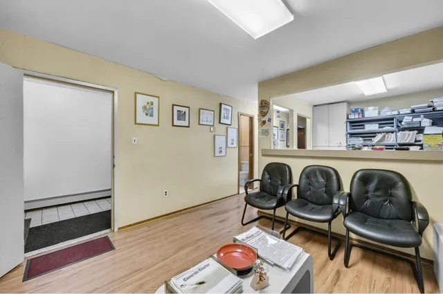 a kitchen with a refrigerator and a stove top oven