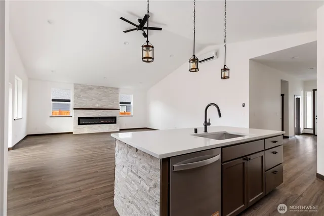 a kitchen with stainless steel appliances a sink and a stove