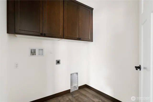 a view of storage and utility room with wooden floor