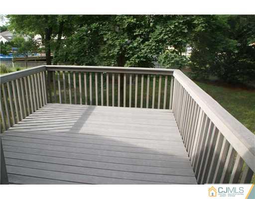 26 Gramercy Road Old Bridge, NJ 08857 - Photo 13 of 14 a balcony view with wooden floor and fence