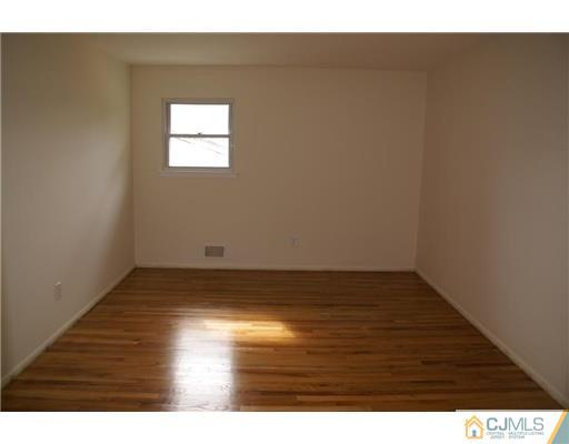 26 Gramercy Road Old Bridge, NJ 08857 - Photo 9 of 14 a view of empty room with wooden floor