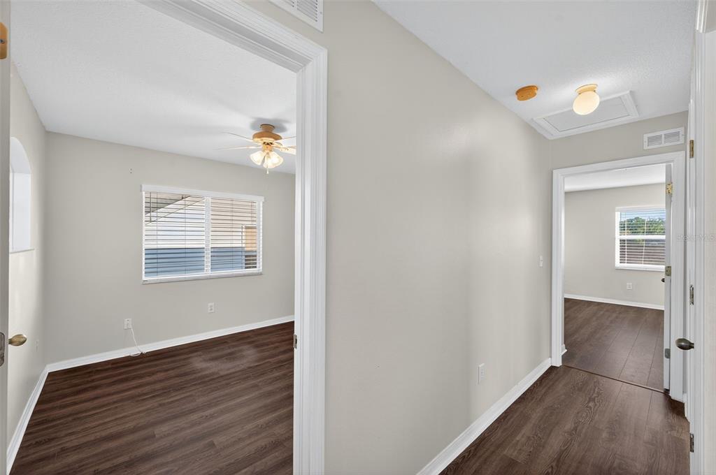 28632 Seashell Court Wesley Chapel, FL 33545 - Photo 28 of 60 a view of an empty room with wooden floor and a window