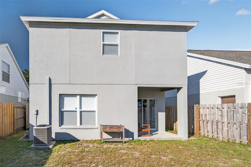 28632 Seashell Court Wesley Chapel, FL 33545 - Photo 46 of 60 a bedroom with a bed and a large window