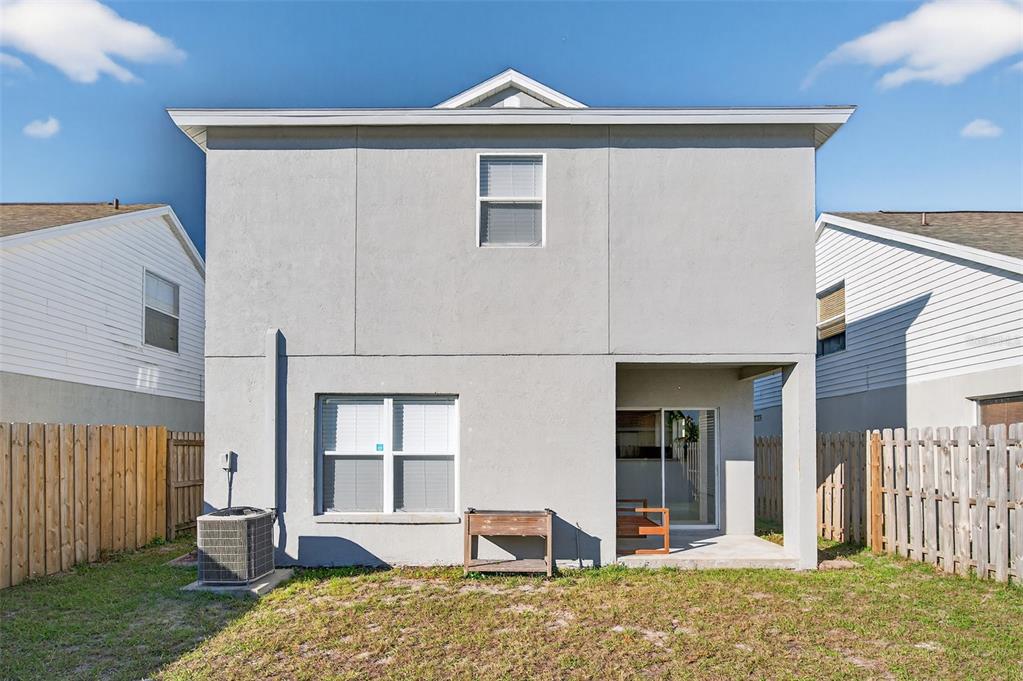 28632 Seashell Court Wesley Chapel, FL 33545 - Photo 47 of 60 a front view of a house with a yard