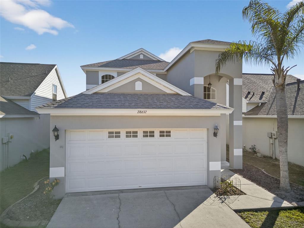 28632 Seashell Court Wesley Chapel, FL 33545 - Photo 51 of 60 a front view of a house with a garage