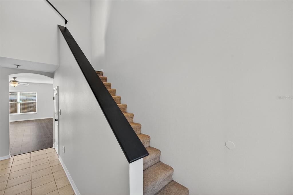 28632 Seashell Court Wesley Chapel, FL 33545 - Photo 6 of 60 a view of entryway and hall with wooden floor