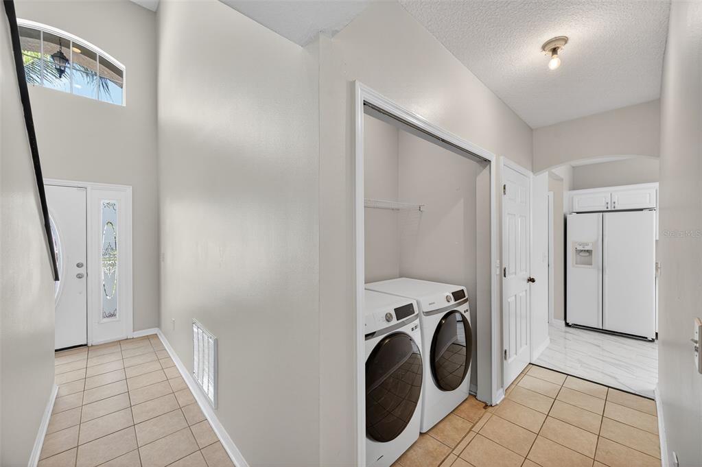 28632 Seashell Court Wesley Chapel, FL 33545 - Photo 7 of 60 a view of a storage & utility room with a washer dryer