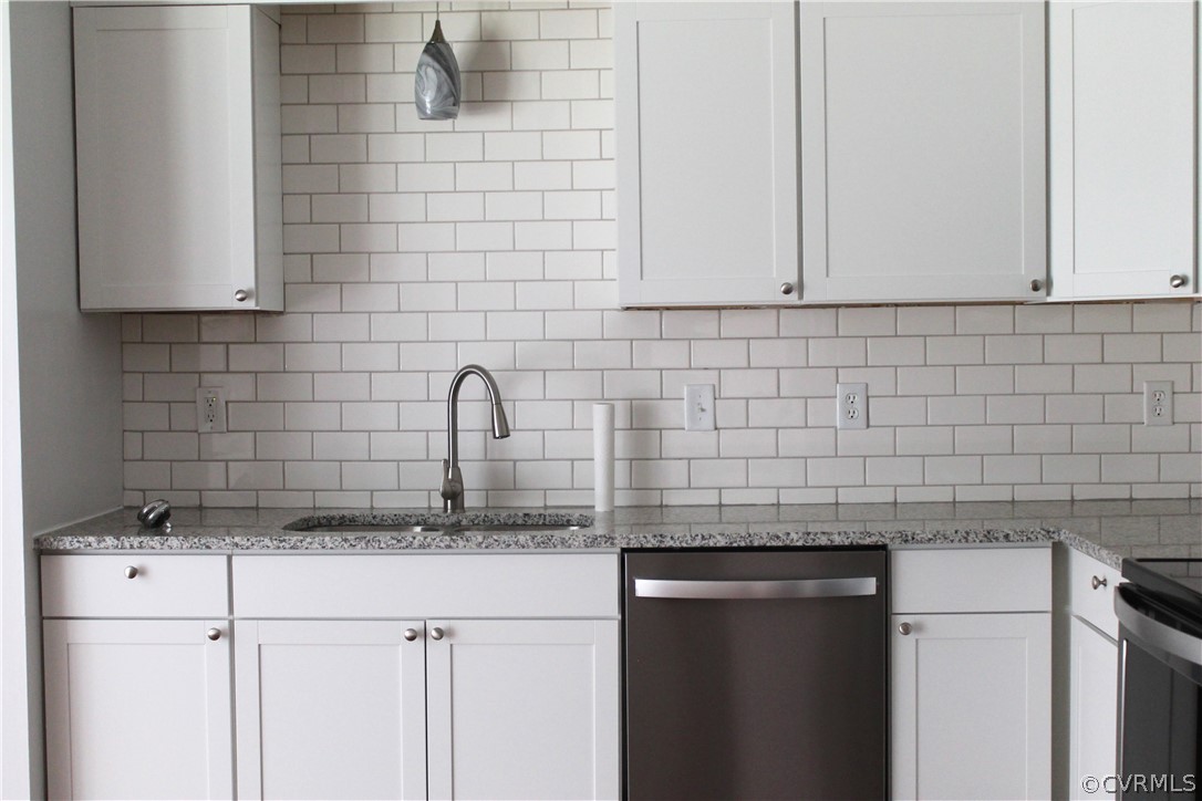 12436 Walkes Quarter Road Chesterfield, VA 23838 - Photo 11 of 31 a kitchen with granite countertop white cabinets and a sink
