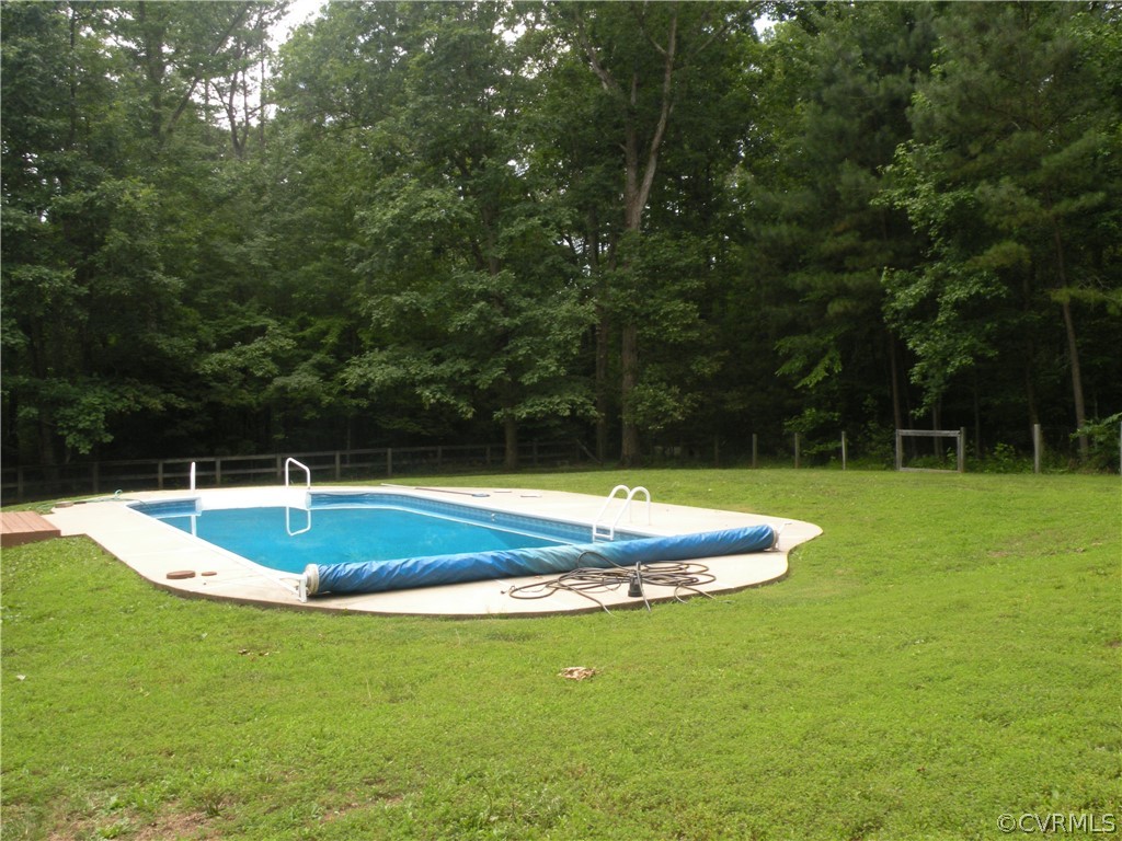 12436 Walkes Quarter Road Chesterfield, VA 23838 - Photo 29 of 31 a view of a swimming pool with a yard