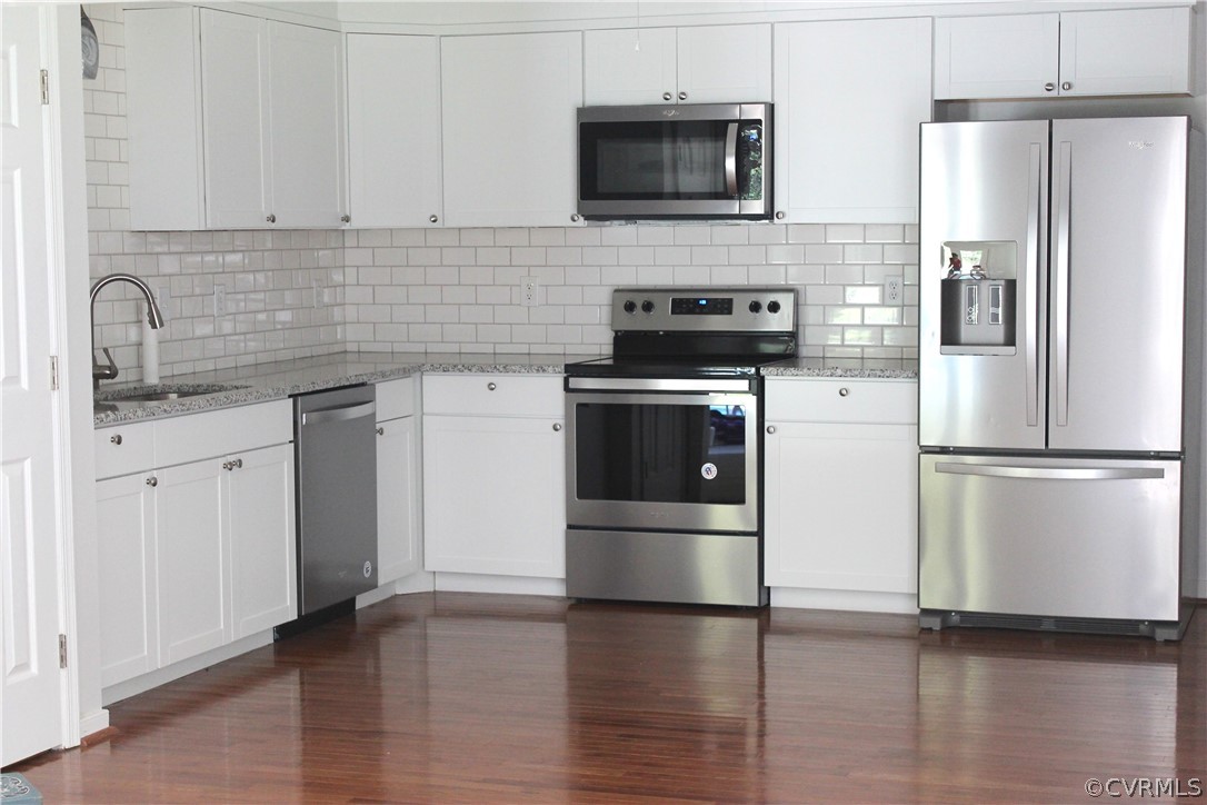 12436 Walkes Quarter Road Chesterfield, VA 23838 - Photo 10 of 31 a kitchen with stainless steel appliances granite countertop a refrigerator a stove a sink and white cabinets