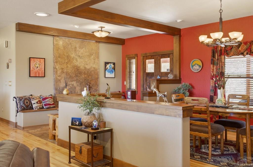 415 Riata Drive Trinidad, CO 81082 - Photo 13 of 61 a view of a dining room with furniture and a chandelier