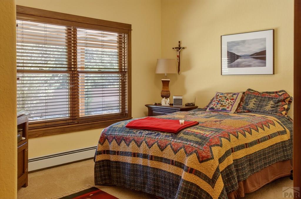 415 Riata Drive Trinidad, CO 81082 - Photo 18 of 61 a bedroom with a bed and a window