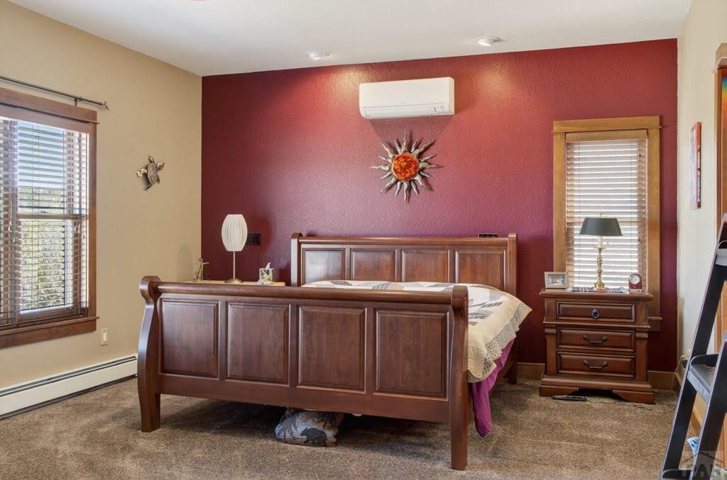 415 Riata Drive Trinidad, CO 81082 - Photo 26 of 61 a bedroom with a bed and window
